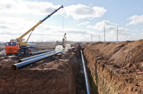 Photo by Shutterstock Construction work on the pipe laying of the pipeline into the trench using a crane / by Shinobi  / Shutterstock